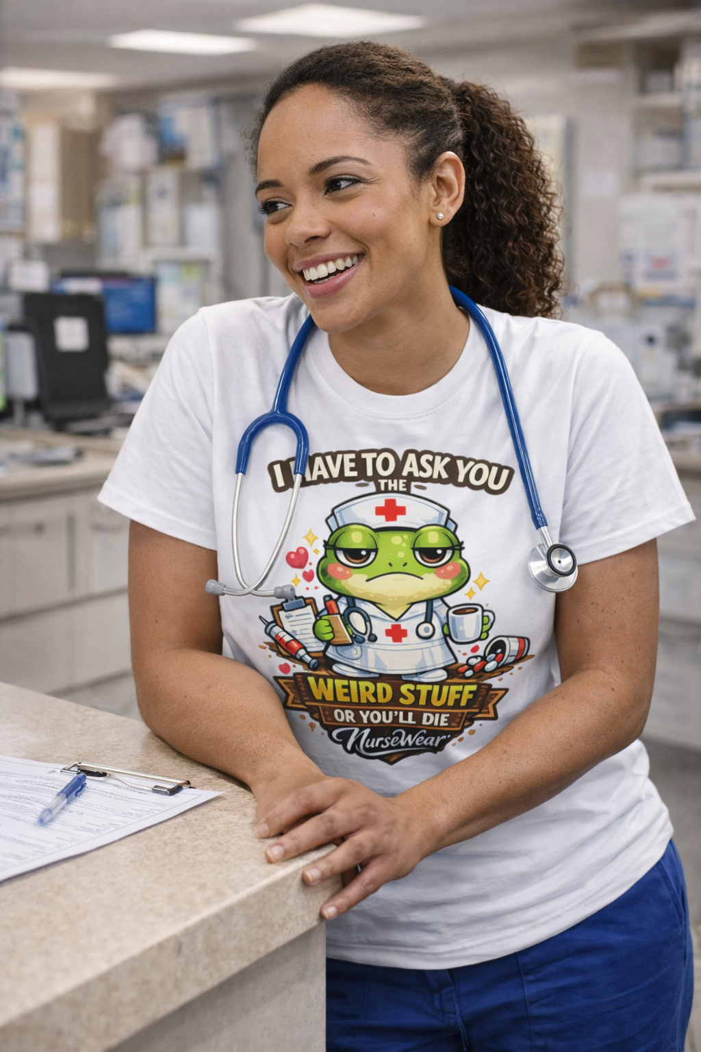 Nurse wearing white I Have to Ask You Weird Stuff or You’ll Die graphic tee at nurses station with blue scrubs and stethoscope