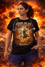 Nurse wearing black Code Blue My Will to Continue graphic tee in dramatic fire-themed promo image with stethoscope and blue scrub pants