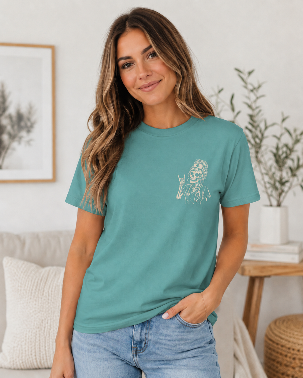 Woman wearing a teal t-shirt with a graphic design in a home setting